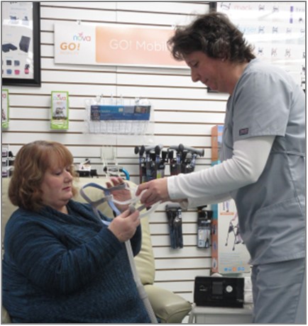 Denise helping a customer.